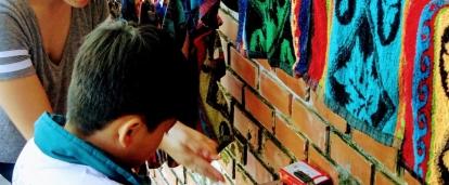 A high school student shows a child how to wash his hands properly as part of her volunteer work in Vietnam with Projects Abroad A volunteer with children in Vietnam teaches basic hygiene as part of our project for teenagers